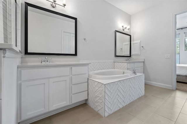 236 Diamondback Dr, Georgetown, TX 78628 - bathroom featuring vanity, tile patterned floors, and a bath