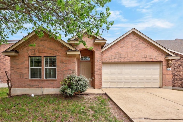2832 Mission Tejas Dr, Pflugerville, TX 78660 - traditional home with brick siding, driveway, and an attached garage