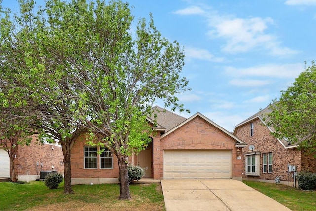 2832 Mission Tejas Dr, Pflugerville, TX 78660 - view of front of house with a garage, concrete driveway, brick siding, and central AC