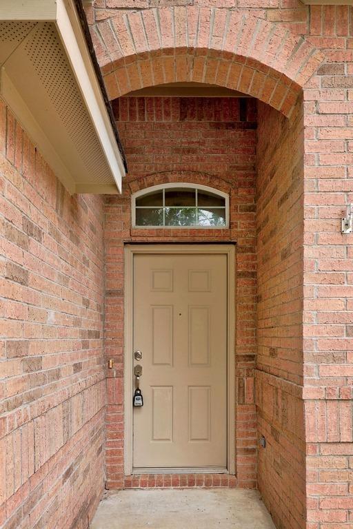 2832 Mission Tejas Dr, Pflugerville, TX 78660 - view of exterior entry with brick siding