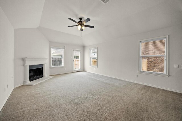 2832 Mission Tejas Dr, Pflugerville, TX 78660 - unfurnished living room with carpet floors, ceiling fan, a fireplace with raised hearth, and lofted ceiling