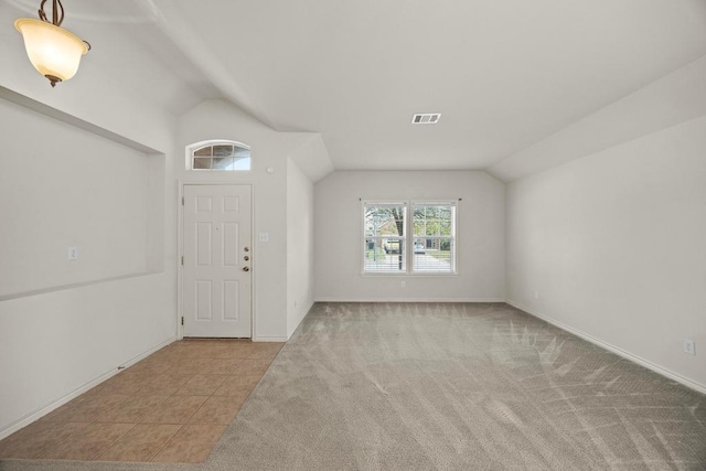 2832 Mission Tejas Dr, Pflugerville, TX 78660 - entrance foyer with lofted ceiling, baseboards, and carpet flooring