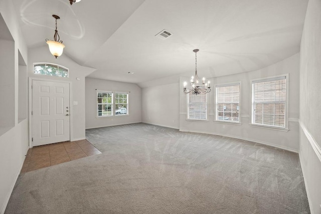 2832 Mission Tejas Dr, Pflugerville, TX 78660 - carpeted entrance foyer with a chandelier, lofted ceiling, baseboards, and tile patterned flooring