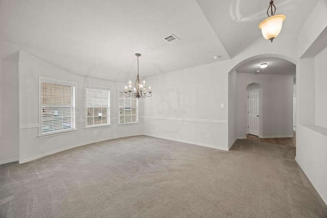 2832 Mission Tejas Dr, Pflugerville, TX 78660 - empty room with carpet, arched walkways, a chandelier, and baseboards