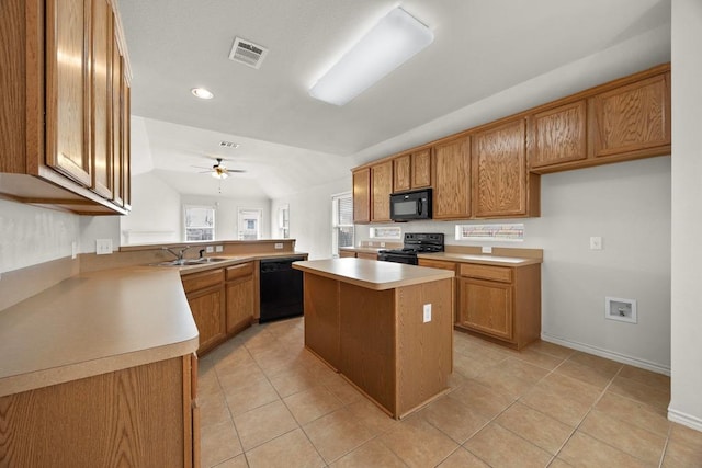 2832 Mission Tejas Dr, Pflugerville, TX 78660 - kitchen featuring black appliances, brown cabinetry, a sink, ceiling fan, and recessed lighting