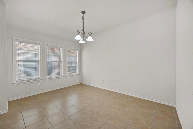 2832 Mission Tejas Dr, Pflugerville, TX 78660 - spare room with a chandelier, baseboards, and light tile patterned floors