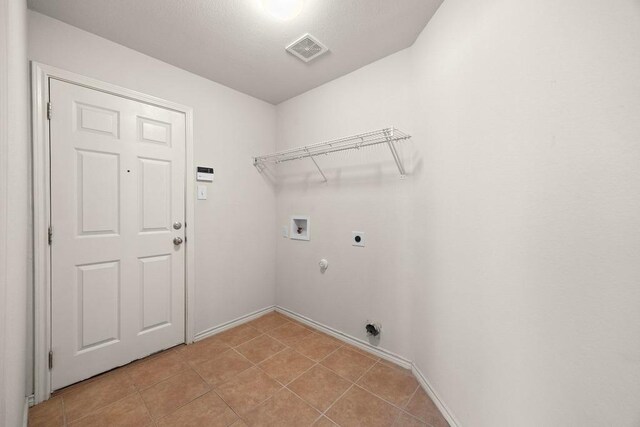 2832 Mission Tejas Dr, Pflugerville, TX 78660 - washroom with hookup for an electric dryer, hookup for a washing machine, gas dryer hookup, and baseboards