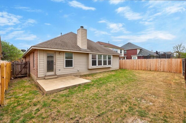 2832 Mission Tejas Dr, Pflugerville, TX 78660 - rear view of property featuring a patio area, a chimney, and a shingled roof