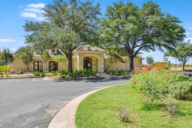 mediterranean / spanish-style home with stucco siding