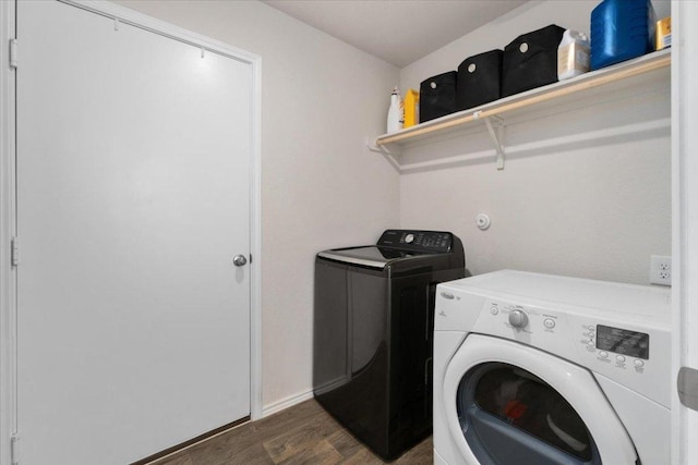 249 Calgary Ln, San Marcos, TX 78666 - laundry area with washer and clothes dryer and dark wood finished floors