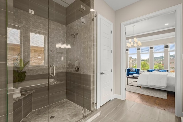 6009 Empresa Dr, Austin, TX 78738 - bathroom featuring ensuite bathroom, tile patterned flooring, a chandelier, and a stall shower