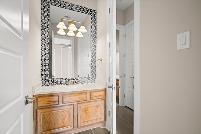 6009 Empresa Dr, Austin, TX 78738 - bathroom featuring vanity, tile patterned floors, and backsplash