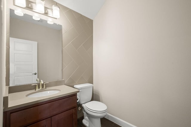 6009 Empresa Dr, Austin, TX 78738 - bathroom featuring vanity, toilet, baseboards, and tile walls