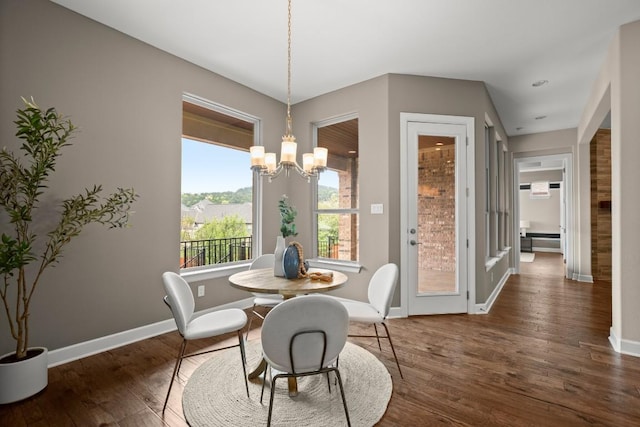 6009 Empresa Dr, Austin, TX 78738 - dining room featuring a chandelier, wood finished floors, and baseboards