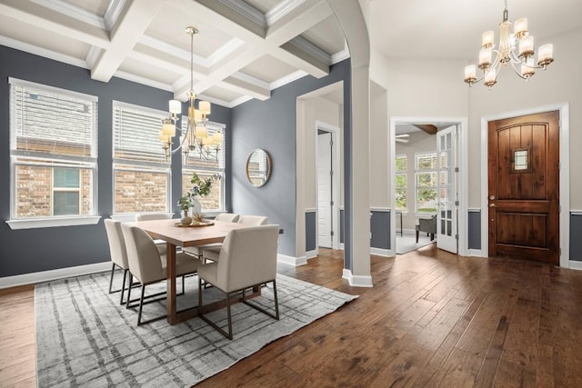 6009 Empresa Dr, Austin, TX 78738 - dining room featuring a chandelier, beamed ceiling, dark wood-type flooring, baseboards, and ornamental molding