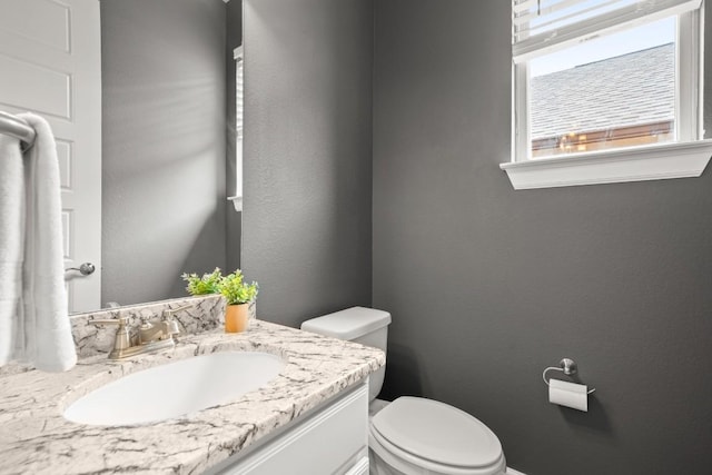 6009 Empresa Dr, Austin, TX 78738 - bathroom with toilet, vanity, and a textured wall