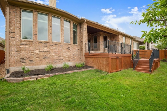 6009 Empresa Dr, Austin, TX 78738 - back of property with brick siding, a yard, a wooden deck, a chimney, and stairs