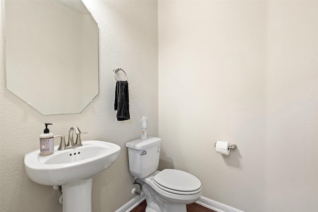 7709 Menchaca Rd Unit 35, Austin, TX 78745 - half bathroom with toilet and baseboards