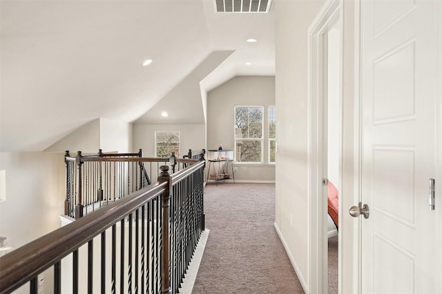 7709 Menchaca Rd Unit 35, Austin, TX 78745 - corridor featuring carpet flooring, vaulted ceiling, recessed lighting, and an upstairs landing