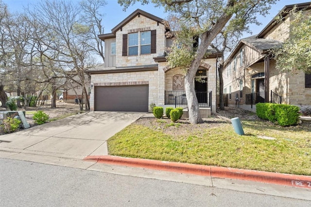 7709 Menchaca Rd Unit 35, Austin, TX 78745 - view of front of house with stone siding, an attached garage, concrete driveway, and a front lawn