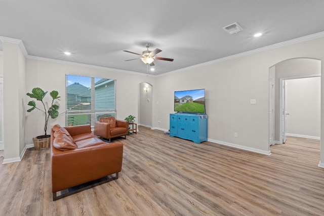 1806 Ashburn Dr, Temple, TX 76502 - living area featuring arched walkways, wood finished floors, a ceiling fan, recessed lighting, and ornamental molding