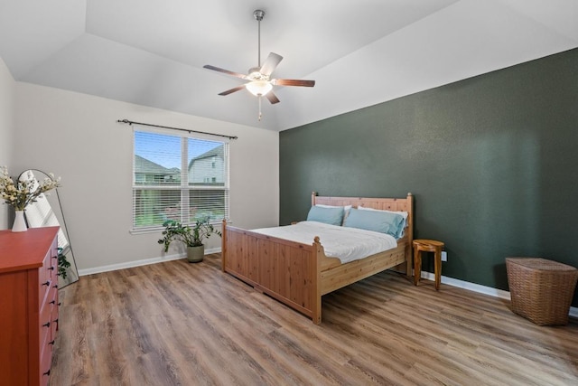 1806 Ashburn Dr, Temple, TX 76502 - bedroom with light wood finished floors, vaulted ceiling, and a ceiling fan