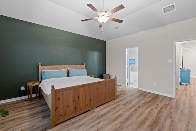 1806 Ashburn Dr, Temple, TX 76502 - bedroom with wood finished floors, connected bathroom, and ceiling fan