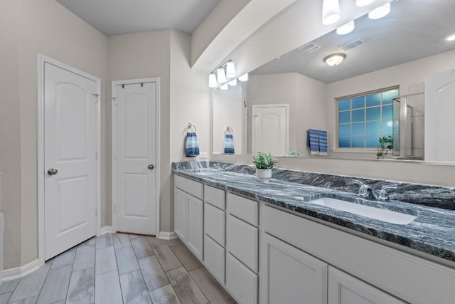 1806 Ashburn Dr, Temple, TX 76502 - bathroom with double vanity and an enclosed shower