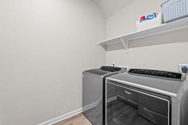 1806 Ashburn Dr, Temple, TX 76502 - washroom featuring washing machine and clothes dryer and dark wood-style flooring