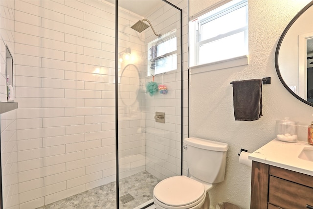 11501 Oak Knoll Dr, Austin, TX 78759 - full bathroom with vanity, tiled shower, and a textured wall