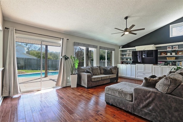 11501 Oak Knoll Dr, Austin, TX 78759 - living room featuring a textured ceiling, ceiling fan, dark wood-type flooring, and high vaulted ceiling