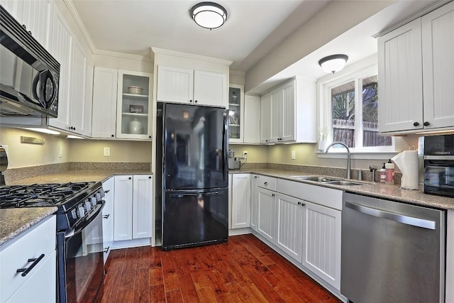 11501 Oak Knoll Dr, Austin, TX 78759 - kitchen with black appliances, dark wood-style floors, glass insert cabinets, and white cabinetry