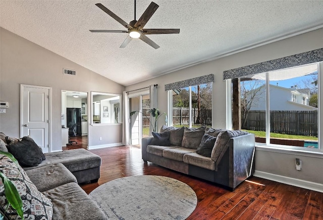 11501 Oak Knoll Dr, Austin, TX 78759 - living area with a textured ceiling, ceiling fan, dark wood-style floors, and lofted ceiling