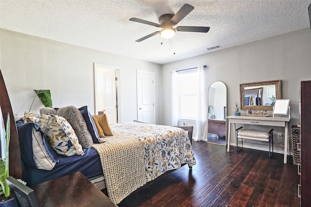 11501 Oak Knoll Dr, Austin, TX 78759 - bedroom featuring hardwood / wood-style floors, a textured ceiling, and a ceiling fan