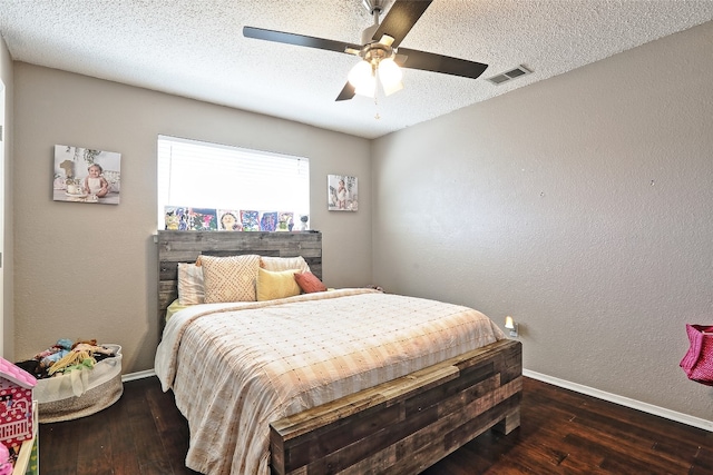 11501 Oak Knoll Dr, Austin, TX 78759 - bedroom with hardwood / wood-style floors, ceiling fan, a textured ceiling, and a textured wall