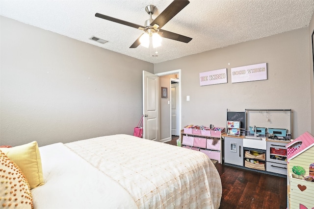 11501 Oak Knoll Dr, Austin, TX 78759 - bedroom featuring hardwood / wood-style floors, a textured ceiling, and ceiling fan