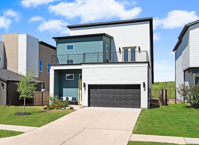 6020 Sendero Hills Pkwy, Austin, TX 78724 - contemporary house featuring a balcony, a garage, and driveway