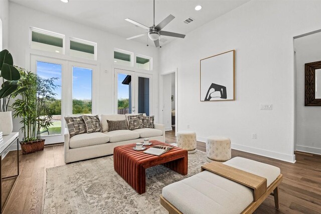 6020 Sendero Hills Pkwy, Austin, TX 78724 - living area featuring healthy amount of natural light, wood finished floors, ceiling fan, recessed lighting, and a high ceiling