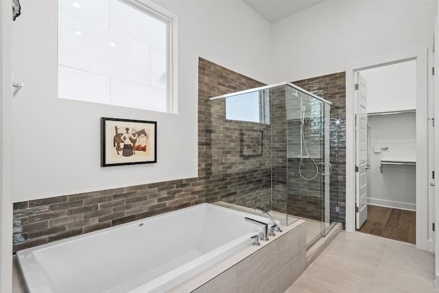 6020 Sendero Hills Pkwy, Austin, TX 78724 - full bathroom with a garden tub, a stall shower, and a spacious closet