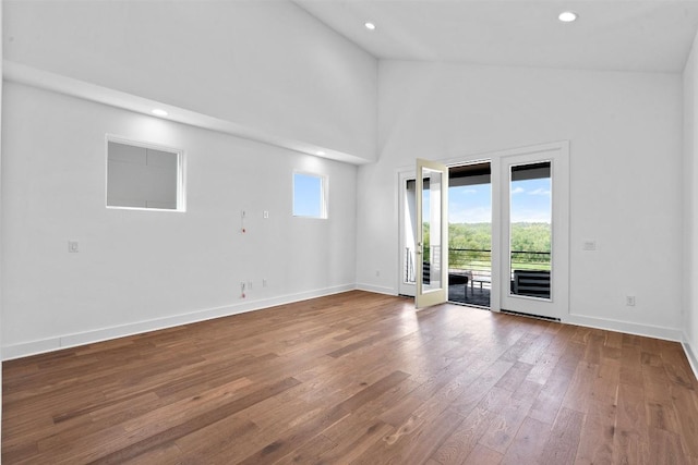 6020 Sendero Hills Pkwy, Austin, TX 78724 - empty room with wood-type flooring, recessed lighting, and vaulted ceiling