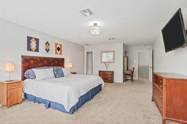 bedroom with light carpet and visible vents