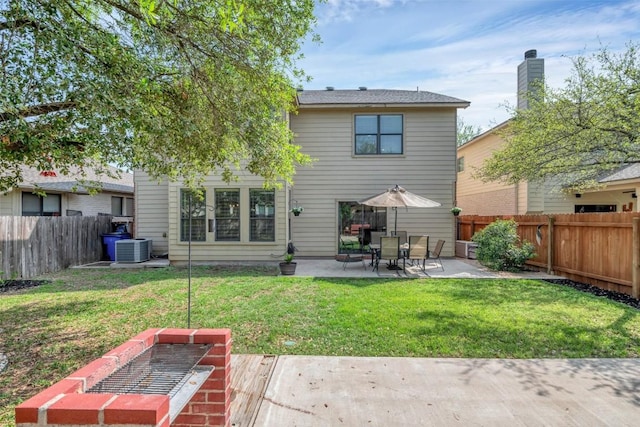 back of house with a fenced backyard, central AC unit, a yard, and a patio