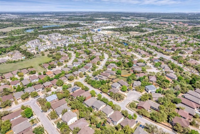 aerial view featuring a residential view and a water view