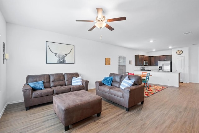 234 George Neggan Ln, Bastrop, TX 78602 - living area with light wood-style floors, a ceiling fan, recessed lighting, and baseboards