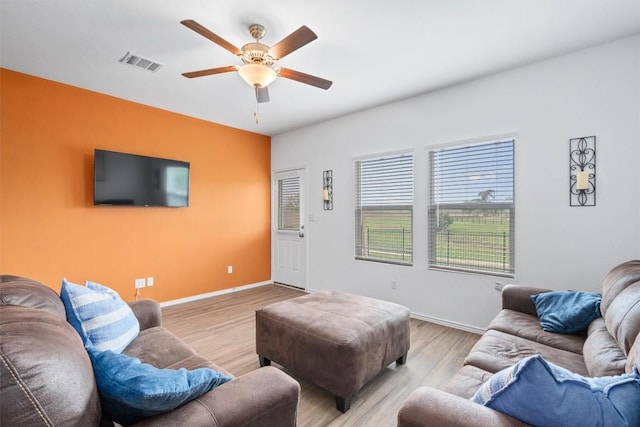 234 George Neggan Ln, Bastrop, TX 78602 - living area with ceiling fan, wood finished floors, and baseboards