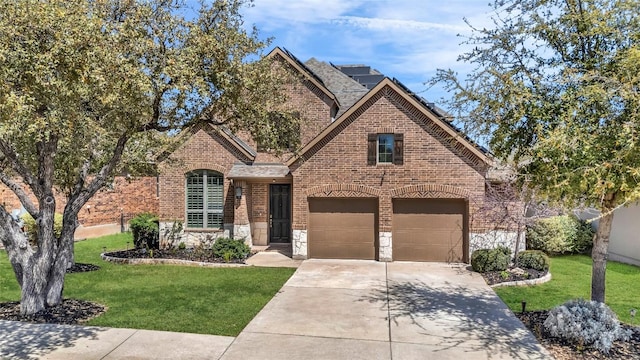 3925 Good Night Trl, Leander, TX 78641 - french country style house featuring brick siding, driveway, a front yard, and stone siding