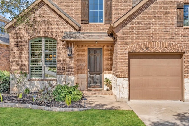 3925 Good Night Trl, Leander, TX 78641 - view of exterior entry featuring brick siding and concrete driveway