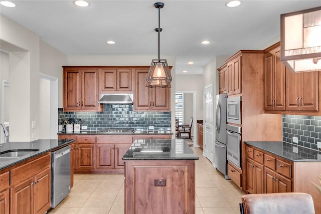 3925 Good Night Trl, Leander, TX 78641 - kitchen featuring stainless steel appliances, under cabinet range hood, a center island, light tile patterned floors, and backsplash