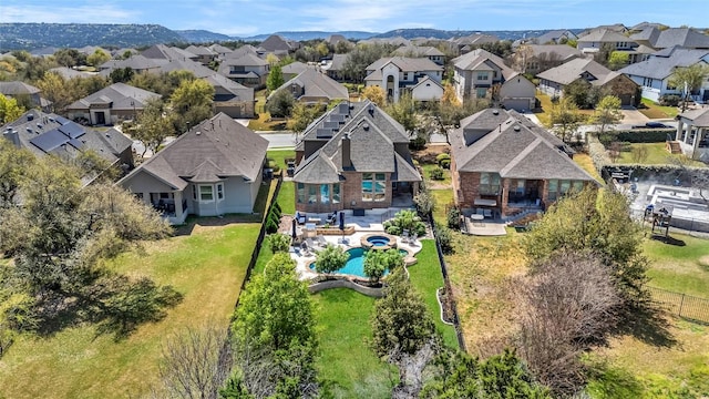 3925 Good Night Trl, Leander, TX 78641 - aerial perspective of suburban area with a pool area