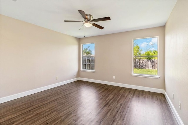 804 Lavaca Loop, Elgin, TX 78621 - empty room with dark wood-style floors and a ceiling fan